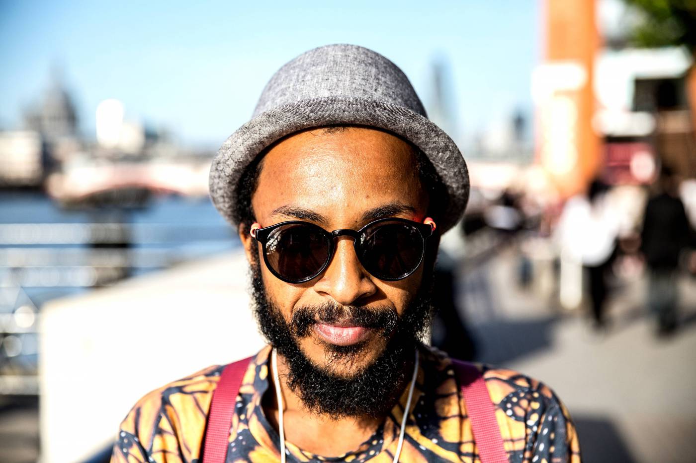 Stylish Man in Sunglasses Captured in Urban Setting picture