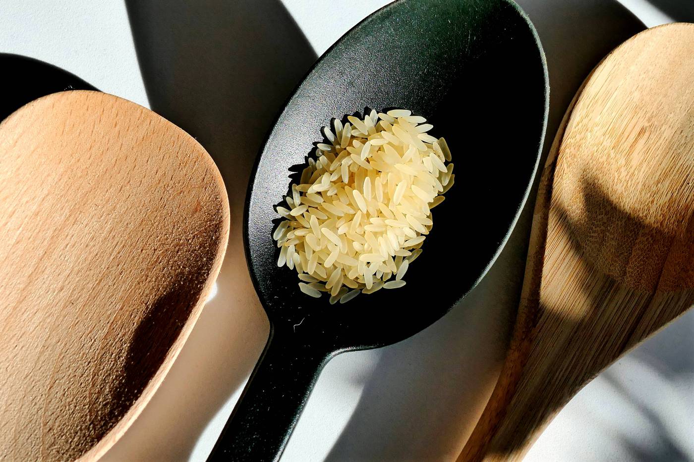 Rice on Spoon: A Close-Up of Deliciously Cooked Rice picture