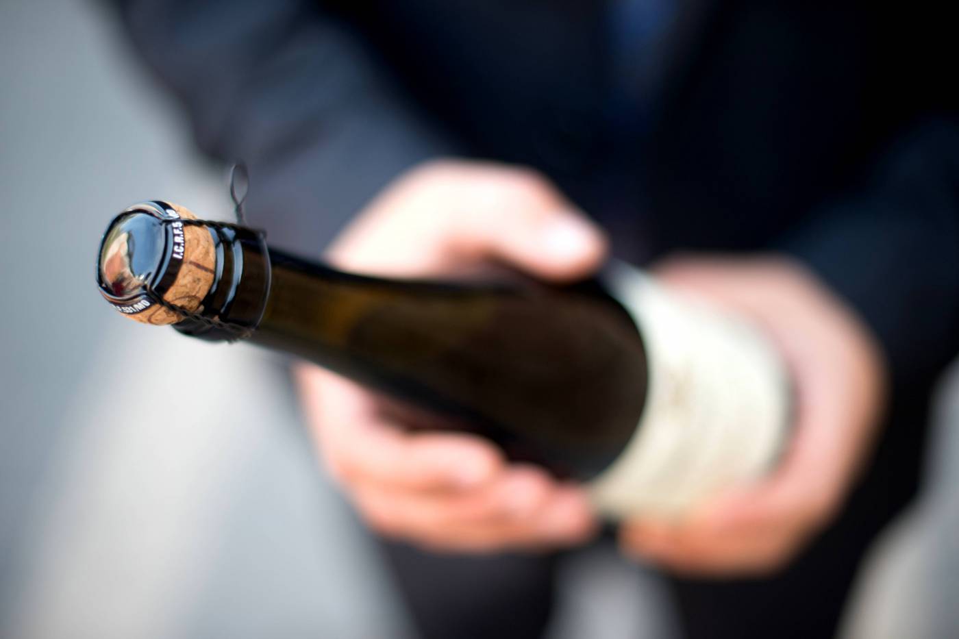 Champagne Wine Celebration: Man Holding a Glass in Elegance picture