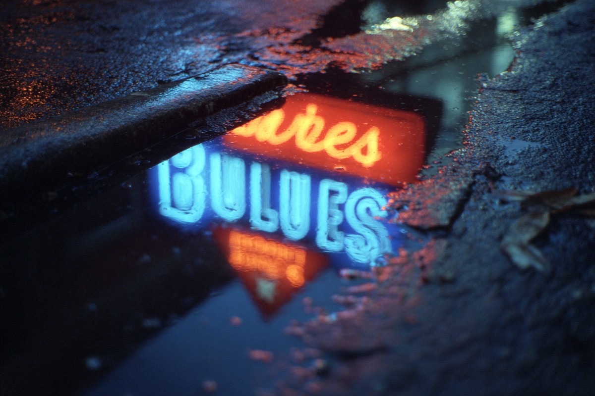 memphis neon blues sign reflection puddle macro e7306920 99a0 4661