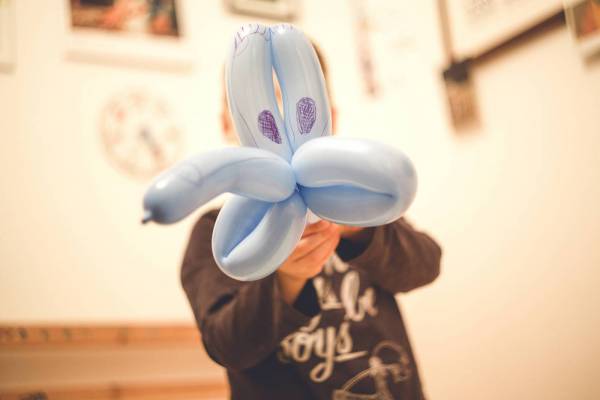 young boy balloon artist/
