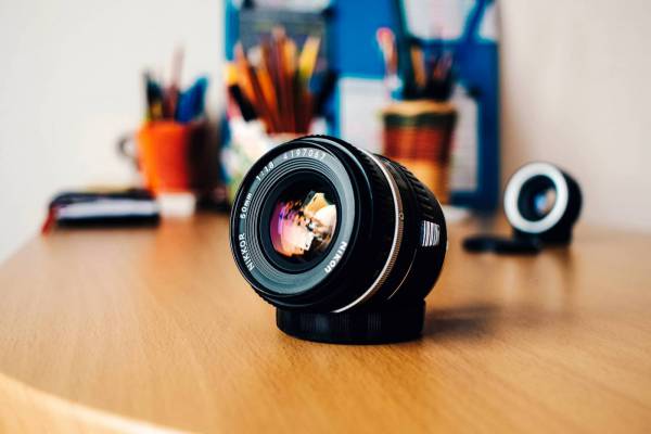 Camera Lens on Desk 